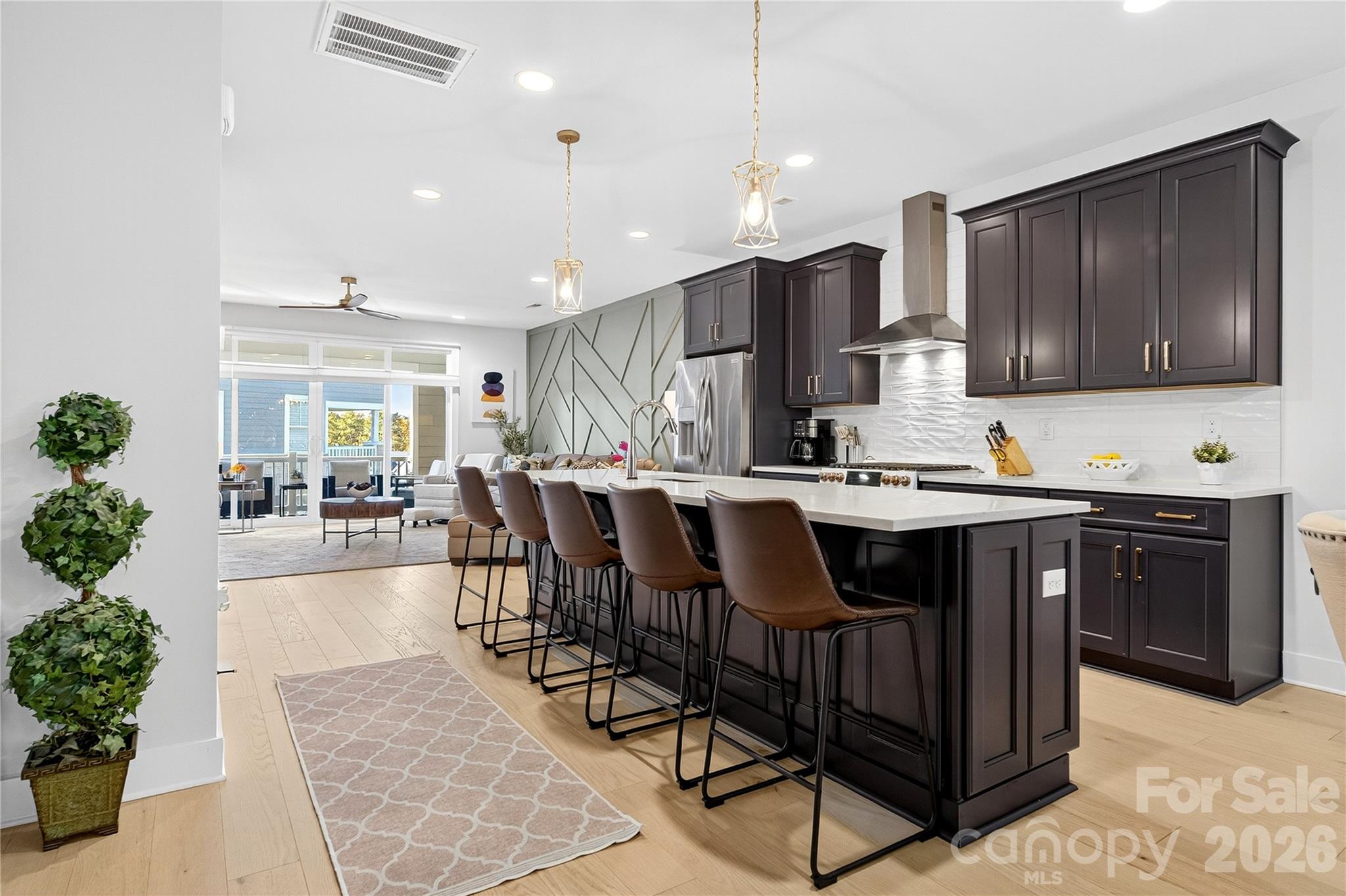 a kitchen with granite countertop a sink and cabinets