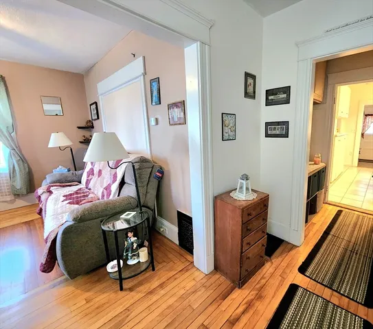 a bedroom with furniture and wooden floor