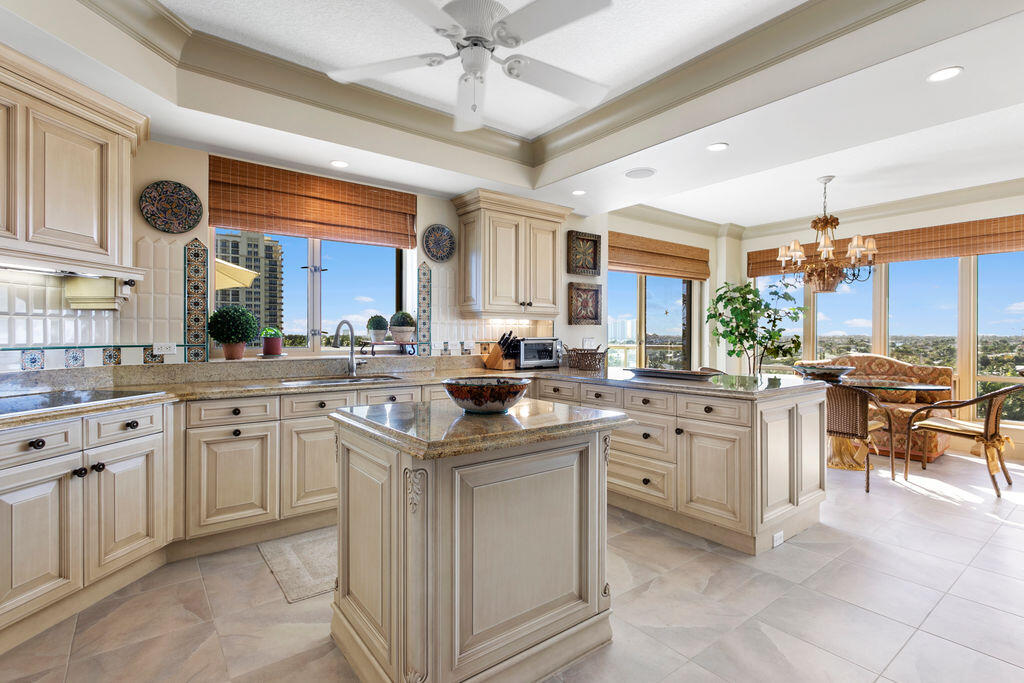 3920 North Ocean Drive, Unit 6A Singer Island, FL 33404 - Photo 12 of 71 a kitchen with sink cabinets and window
