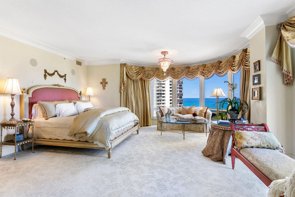 3920 North Ocean Drive, Unit 6A Singer Island, FL 33404 - Photo 21 of 71 a bedroom with furniture and a chandelier