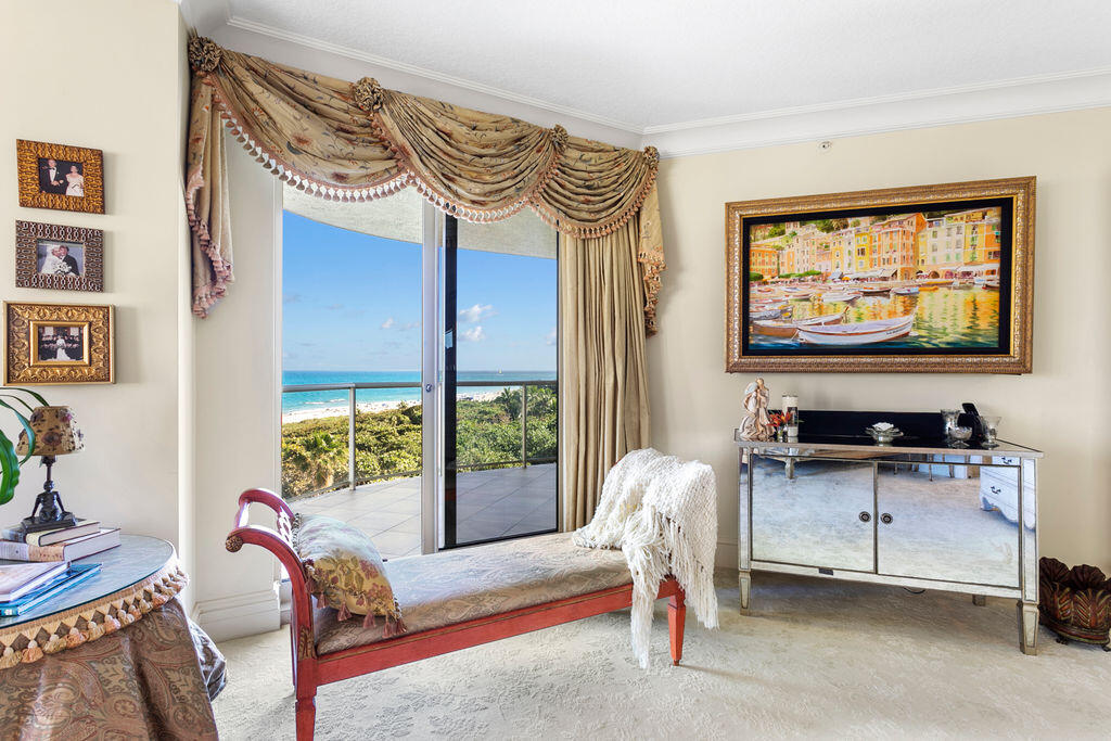 3920 North Ocean Drive, Unit 6A Singer Island, FL 33404 - Photo 22 of 71 a living room with furniture a window and a flat screen tv