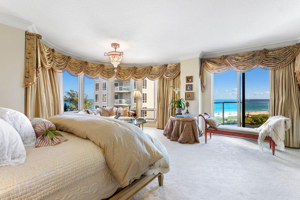 3920 North Ocean Drive, Unit 6A Singer Island, FL 33404 - Photo 23 of 71 a spacious bedroom with a bed and a large window