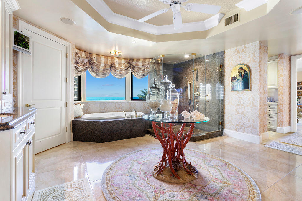 3920 North Ocean Drive, Unit 6A Singer Island, FL 33404 - Photo 25 of 71 a living room with furniture and a chandelier