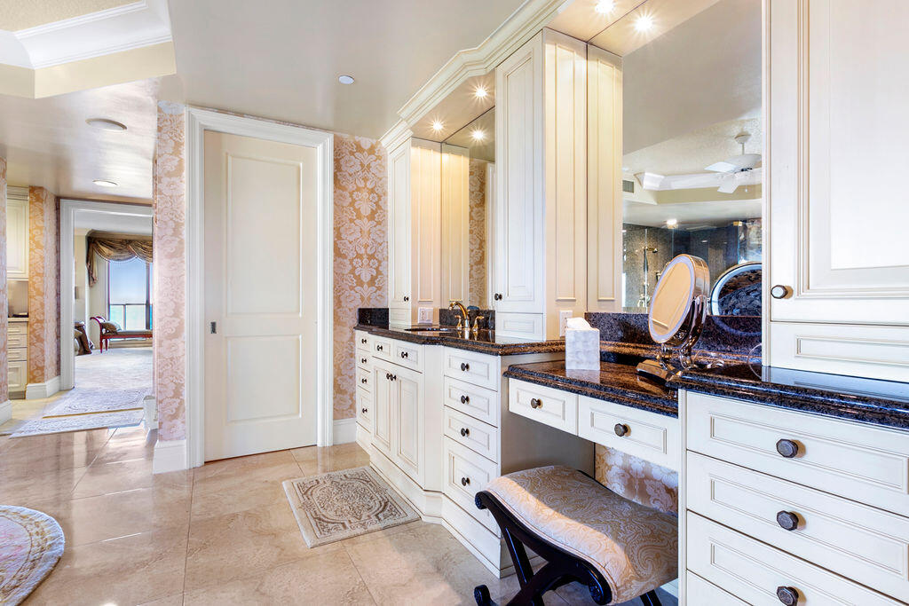 3920 North Ocean Drive, Unit 6A Singer Island, FL 33404 - Photo 27 of 71 a spacious bathroom with a granite countertop sink and a mirror