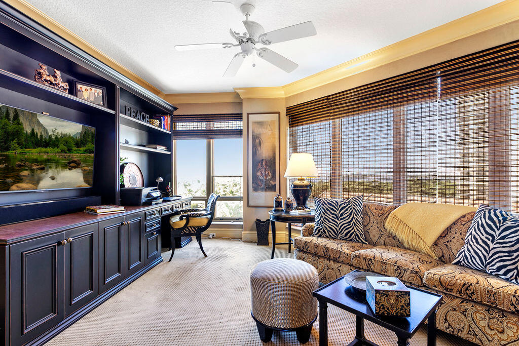 3920 North Ocean Drive, Unit 6A Singer Island, FL 33404 - Photo 29 of 71 a living room with furniture and a flat screen tv