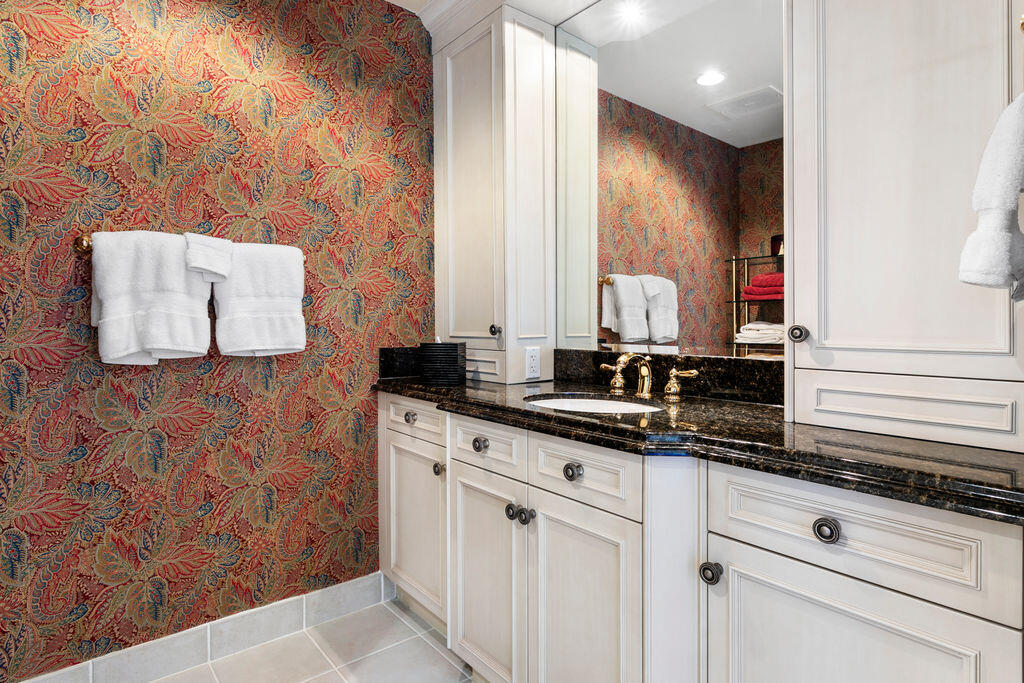 3920 North Ocean Drive, Unit 6A Singer Island, FL 33404 - Photo 32 of 71 a bathroom with a sink and a mirror