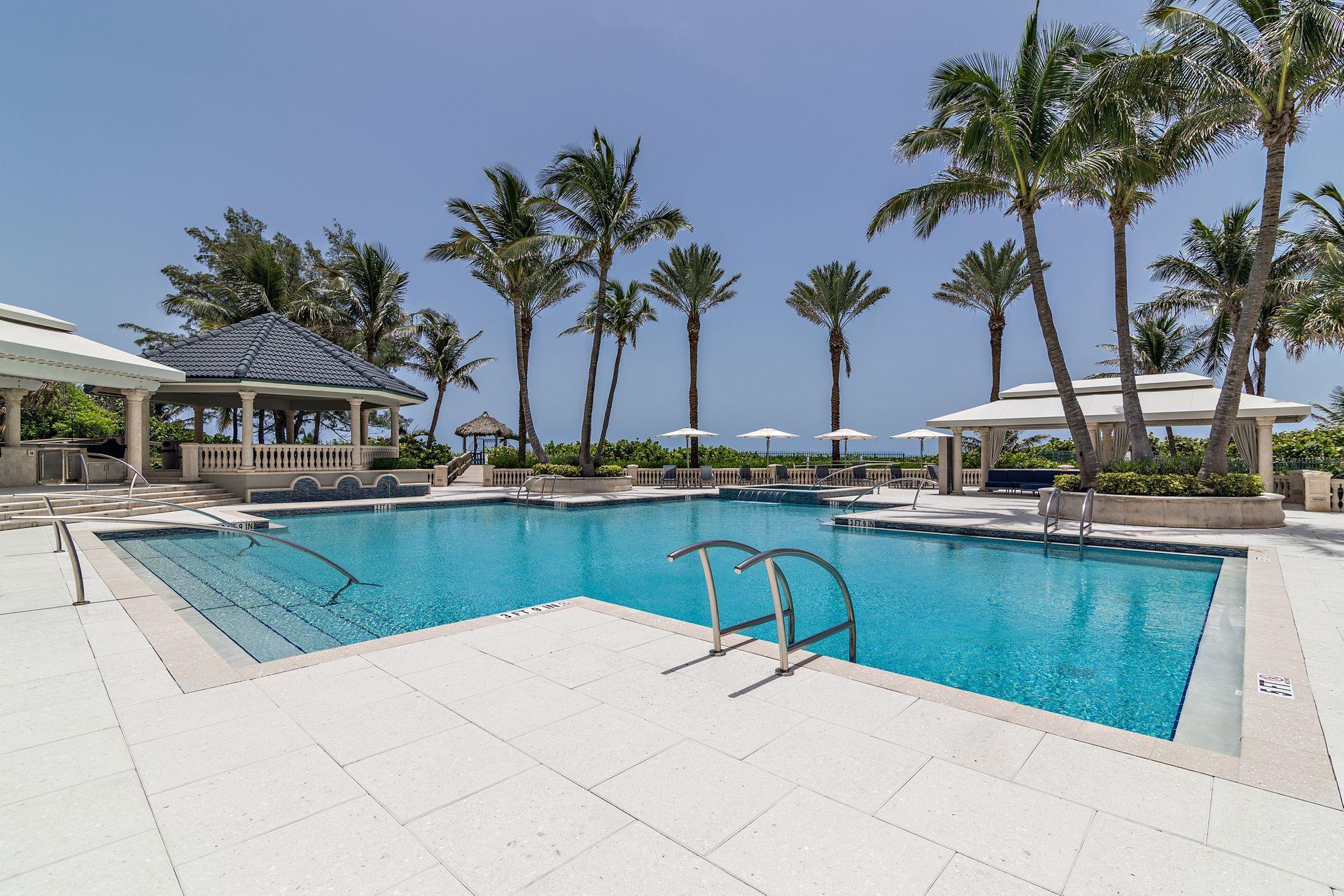 3920 North Ocean Drive, Unit 6A Singer Island, FL 33404 - Photo 38 of 71 a view of swimming pool with outdoor seating and plants
