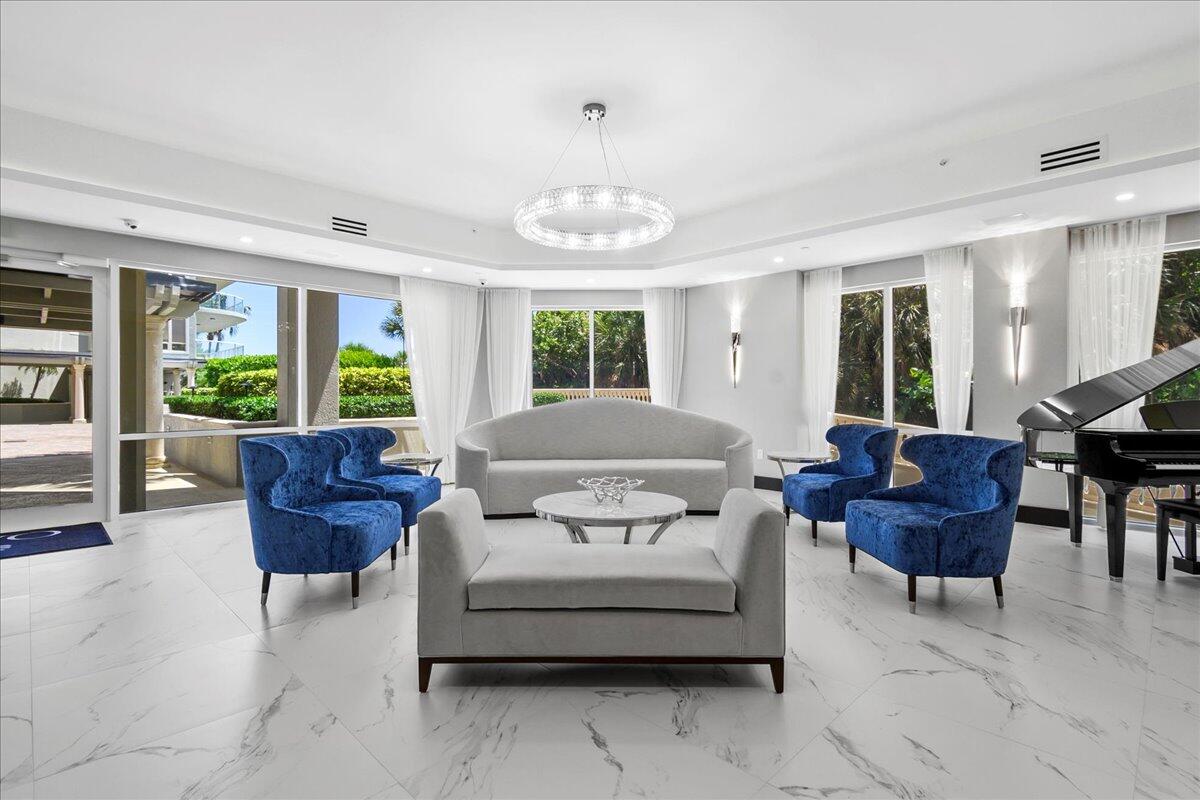 3920 North Ocean Drive, Unit 6A Singer Island, FL 33404 - Photo 49 of 71 a living room with furniture and a large window