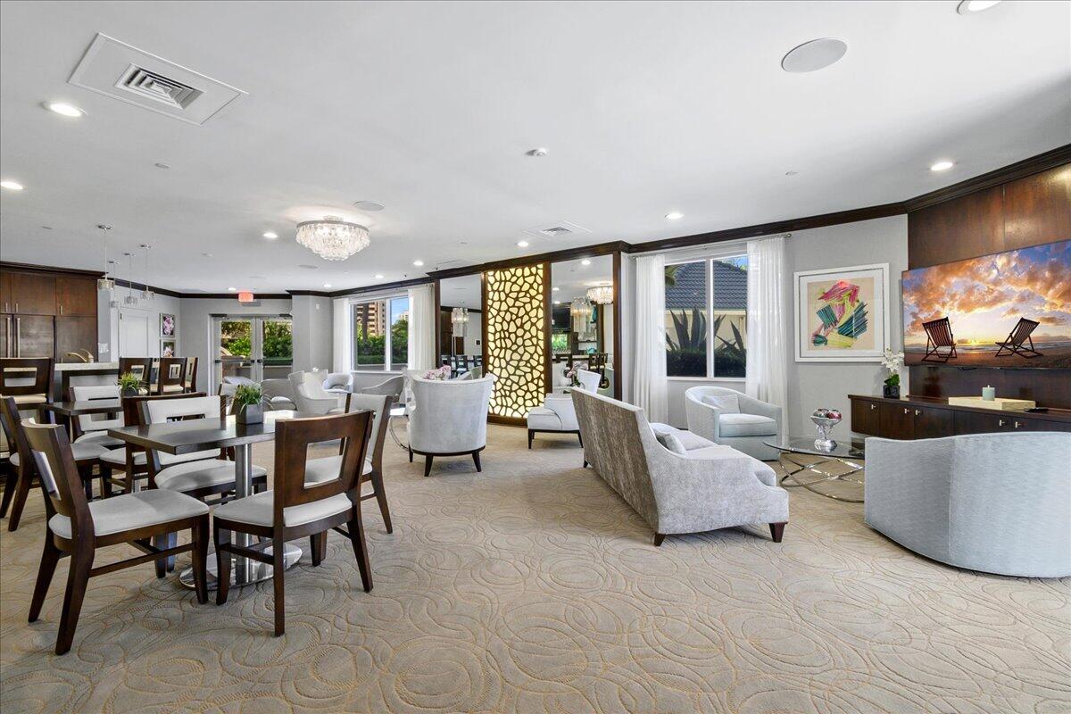 3920 North Ocean Drive, Unit 6A Singer Island, FL 33404 - Photo 53 of 71 a living room with furniture and a flat screen tv