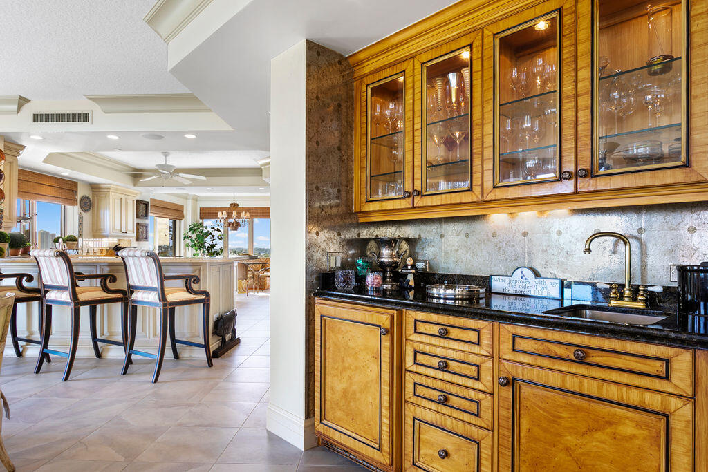 3920 North Ocean Drive, Unit 6A Singer Island, FL 33404 - Photo 9 of 71 a kitchen with stainless steel appliances granite countertop a refrigerator and cabinets