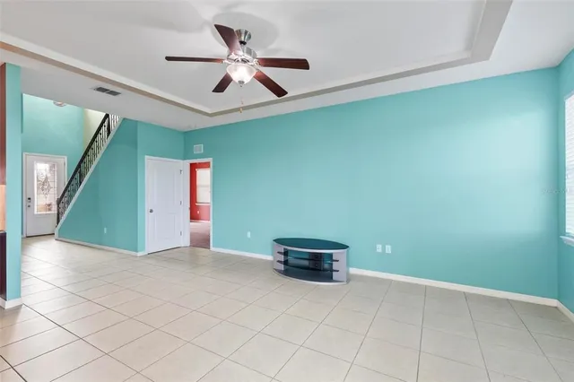 a view of a kitchen with a sink and chandelier