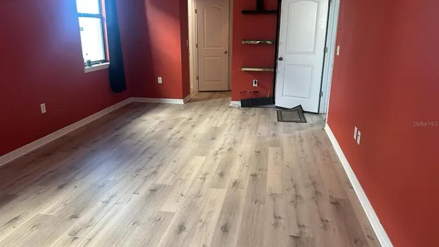 a view of an empty room with a window