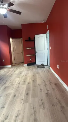 a bathroom with a granite countertop sink a large mirror and a