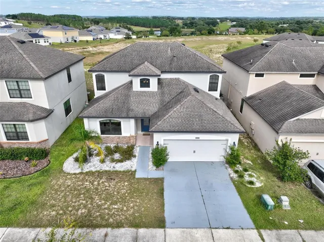 an aerial view of residential building and ocean