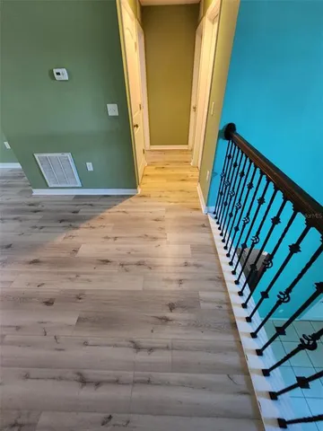 a view of room with window and ceiling fan