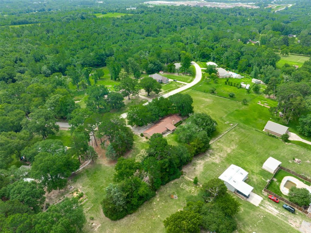 8798 Hill N Dale Road Tyler, TX 75709 - Photo 31 of 31 Expansive rural setting featuring a winding paved road, multiple residential properties, dense tree lines, and open green spaces