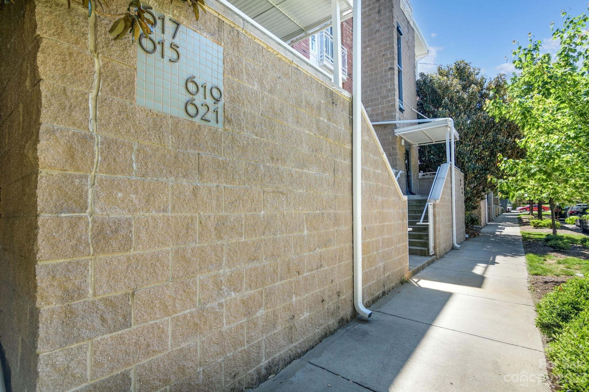 a view of a pathway both side of house