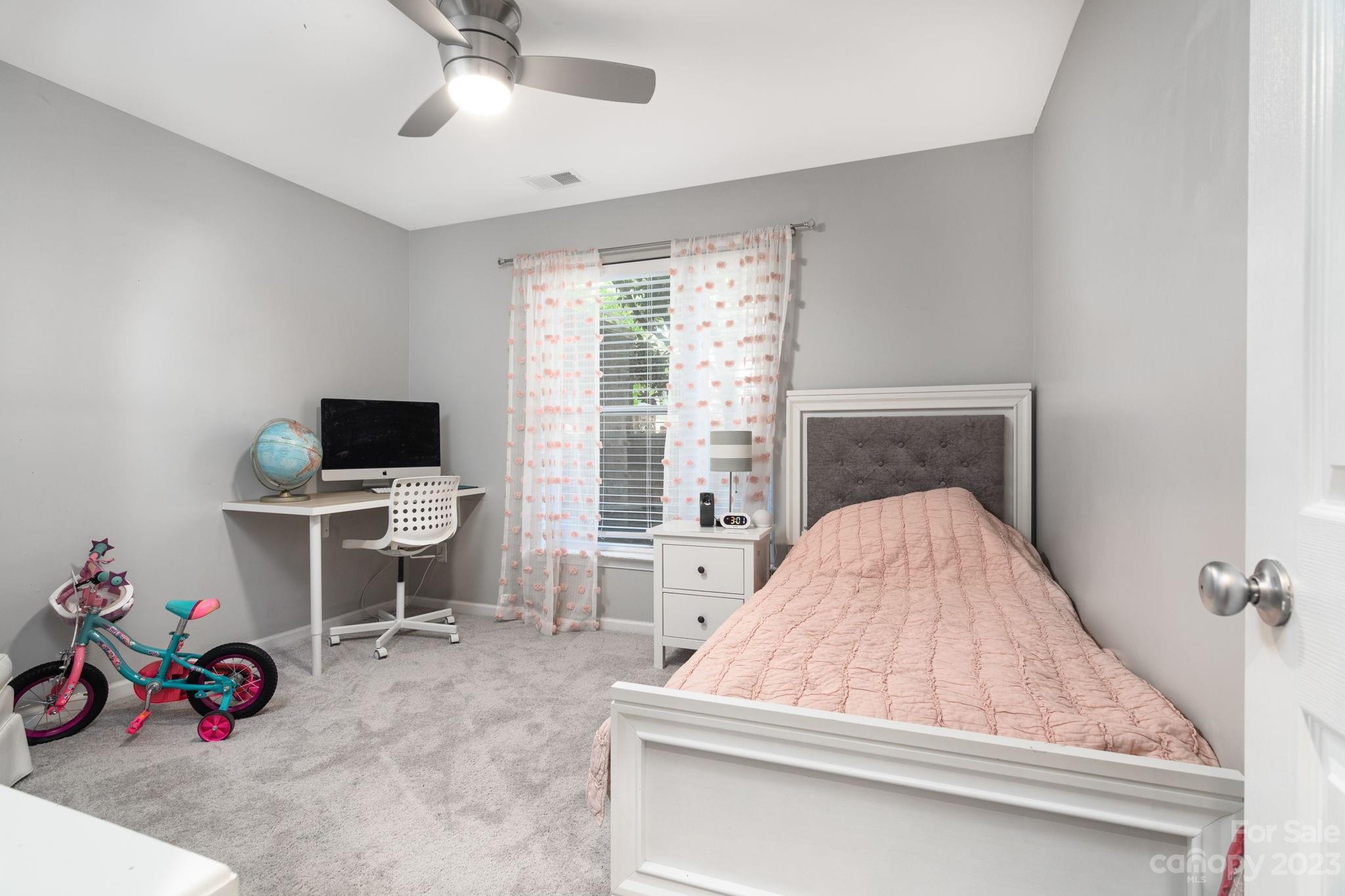 615 Raphael Place Charlotte, NC 28205 - Photo 14 of 20 a bedroom with a bed and a window