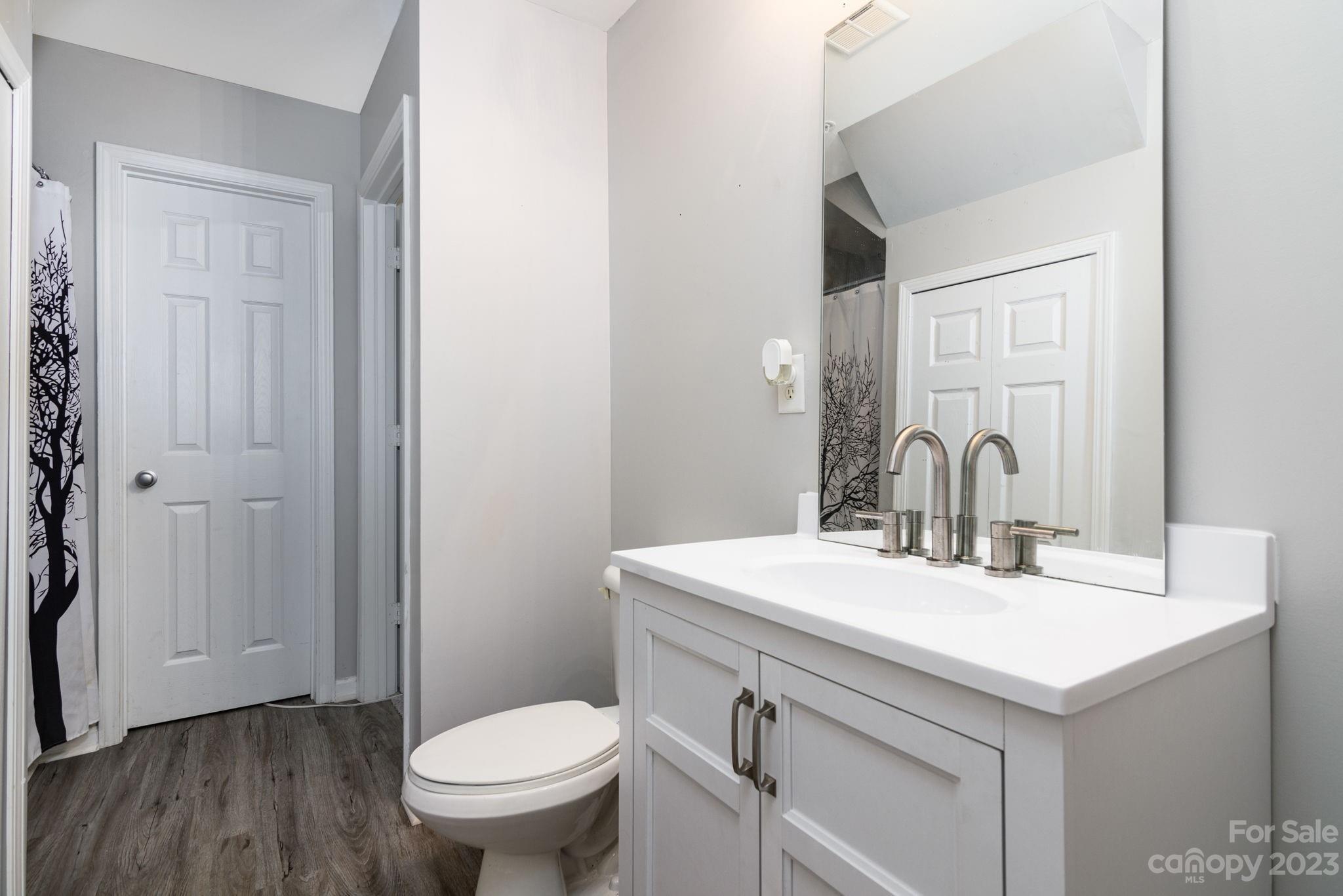 615 Raphael Place Charlotte, NC 28205 - Photo 15 of 20 a bathroom with a sink toilet and a mirror