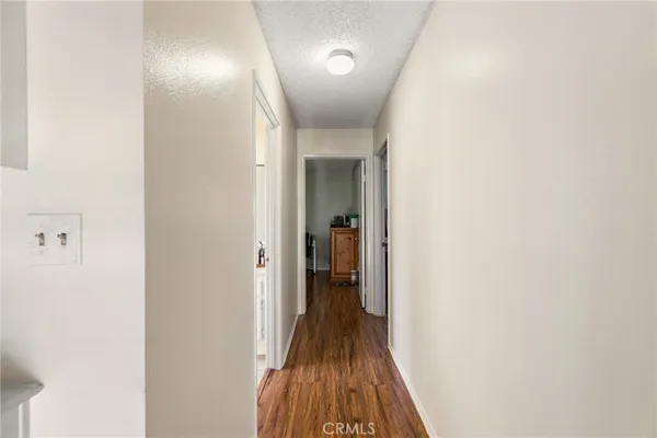 a bathroom with a sink toilet vanity and mirror