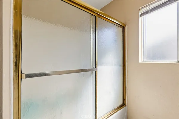 a bed room with a bed and a flat screen tv