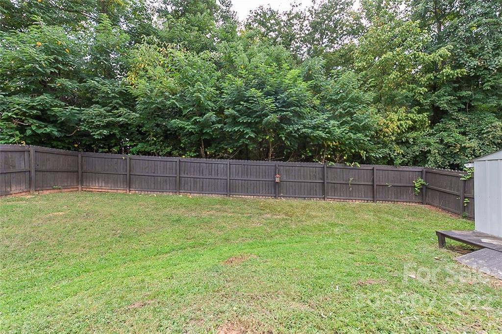 705 Jones Branch Road Fort Mill, SC 29715 - Photo 16 of 18 a view of a backyard with wooden fence