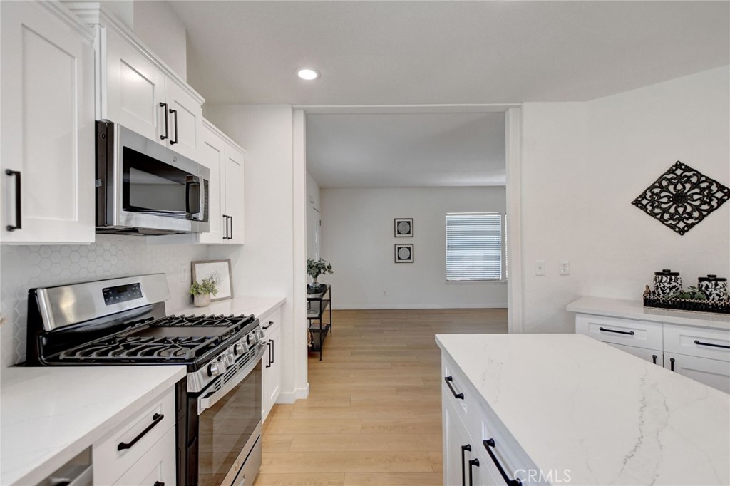 8651 Foothill Boulevard, Unit 42 Rancho Cucamonga, CA 91730 - Photo 13 of 39 a kitchen with a stove and a microwave