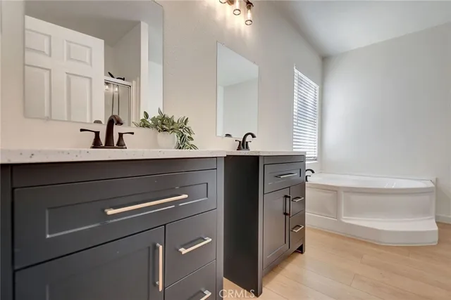 a kitchen with a sink and a mirror