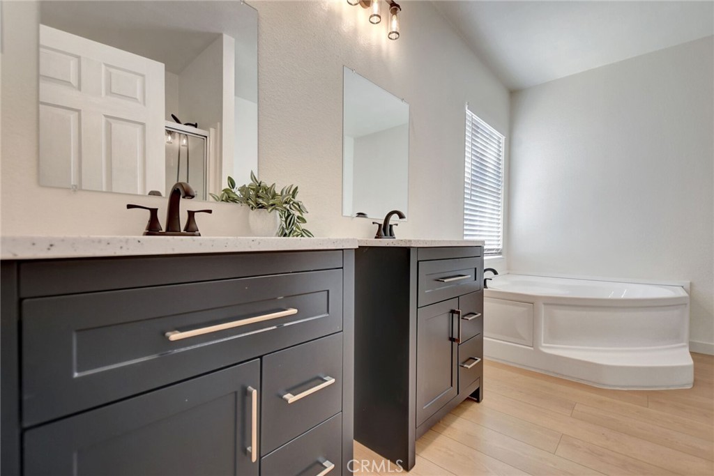 8651 Foothill Boulevard, Unit 42 Rancho Cucamonga, CA 91730 - Photo 24 of 39 a kitchen with a sink and a mirror