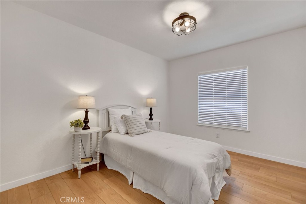 8651 Foothill Boulevard, Unit 42 Rancho Cucamonga, CA 91730 - Photo 26 of 39 a bedroom with a bed and a window