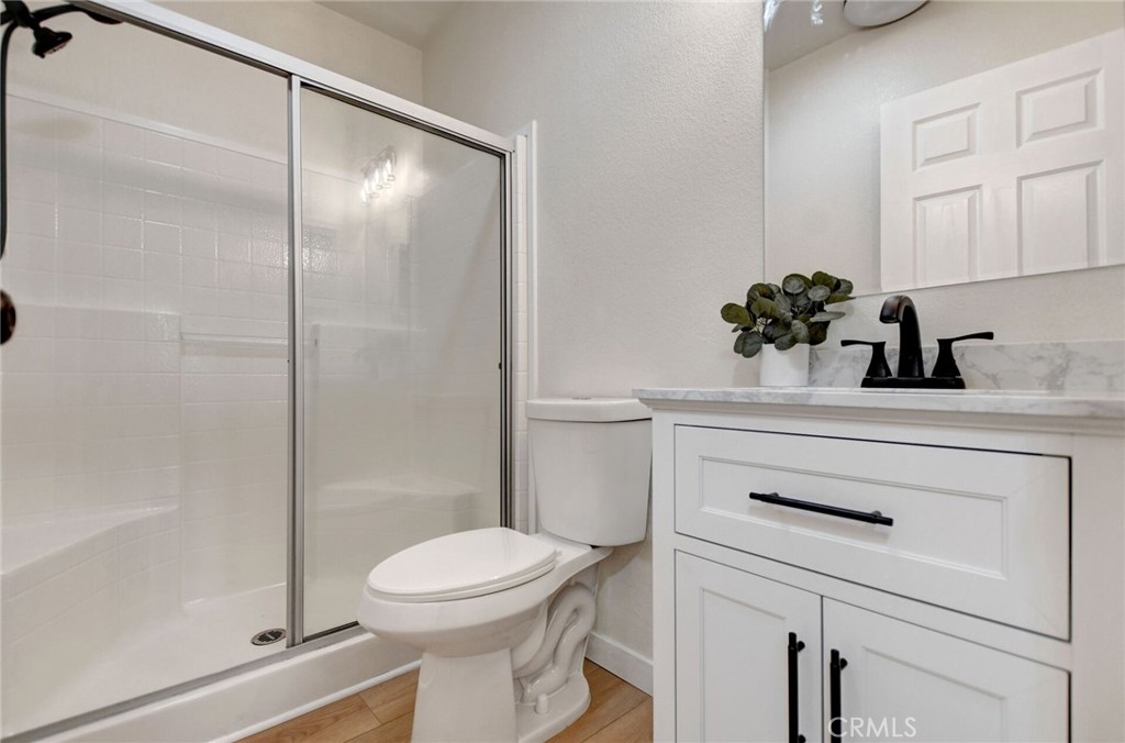 8651 Foothill Boulevard, Unit 42 Rancho Cucamonga, CA 91730 - Photo 28 of 39 a bathroom with a sink a toilet and shower