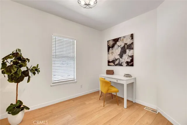 a workspace with furniture and a window