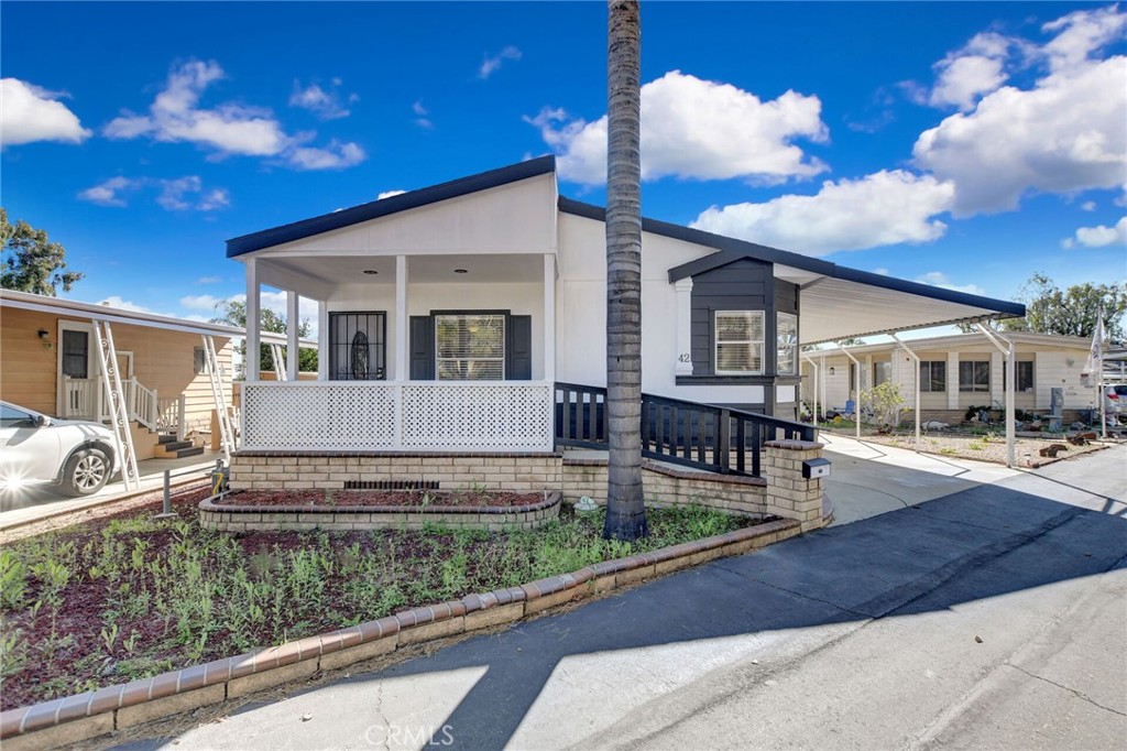 8651 Foothill Boulevard, Unit 42 Rancho Cucamonga, CA 91730 - Photo 38 of 39 a view of a house with sitting area and furniture