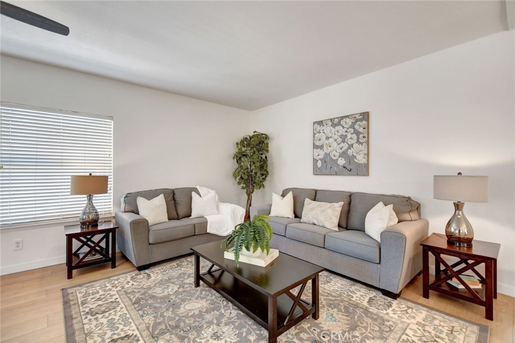 8651 Foothill Boulevard, Unit 42 Rancho Cucamonga, CA 91730 - Photo 9 of 39 a living room with furniture and a large window