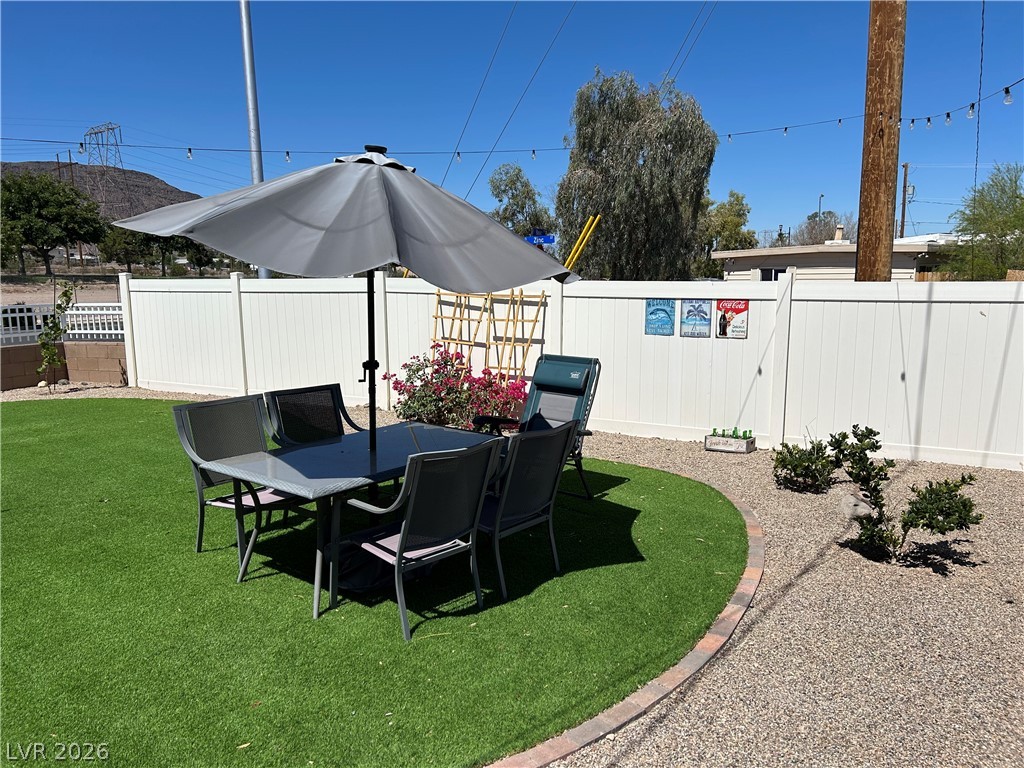 116 West Basic Road Henderson, NV 89015 - Photo 3 of 39 A well-appointed yard provides the ideal setting for outdoor dining and relaxation.