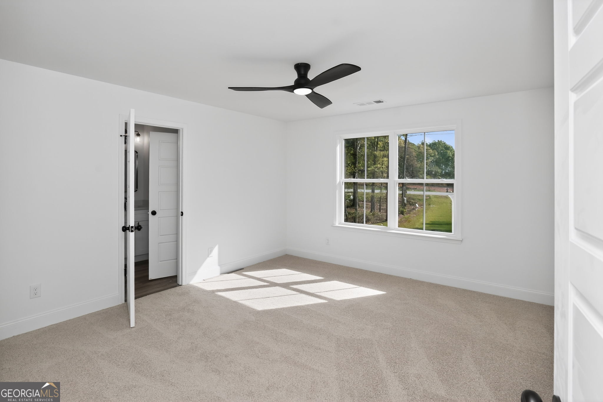 1229 Chappell Mill Road Jackson, GA 30233 - Photo 45 of 55 an empty room with windows and closet