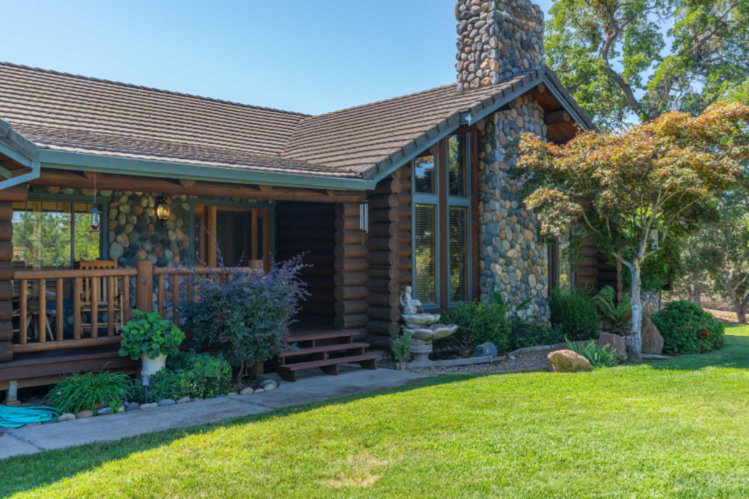 391 Spyglass Road Valley Springs, CA 95252 - Photo 1 of 30 a view of a house with a yard and plants