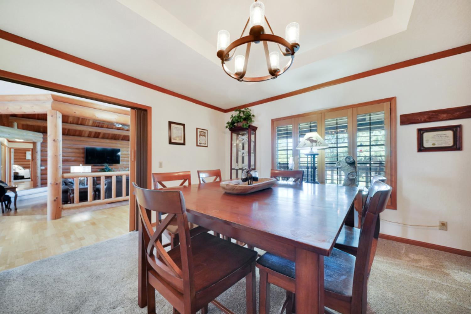 391 Spyglass Road Valley Springs, CA 95252 - Photo 15 of 30 a view of a dining room with furniture window and wooden floor