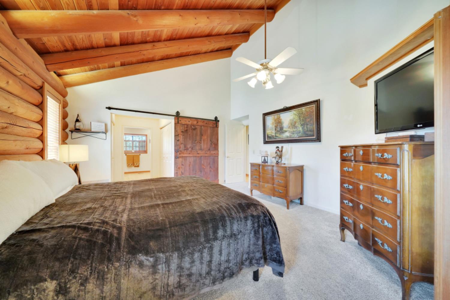 391 Spyglass Road Valley Springs, CA 95252 - Photo 20 of 30 a bedroom with a bed and a flat screen tv