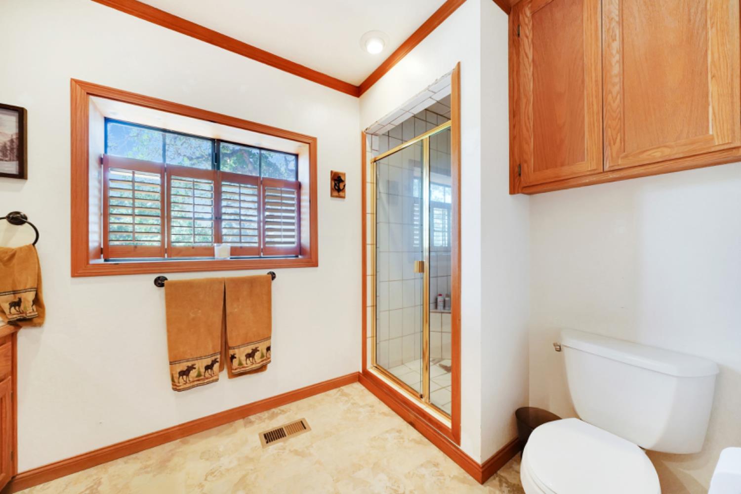 391 Spyglass Road Valley Springs, CA 95252 - Photo 22 of 30 a bathroom with a toilet sink and mirror
