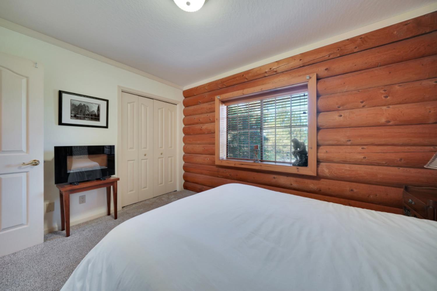 391 Spyglass Road Valley Springs, CA 95252 - Photo 27 of 30 a bedroom with a bed and a flat screen tv
