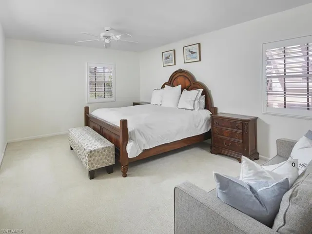 a bedroom with bed and window