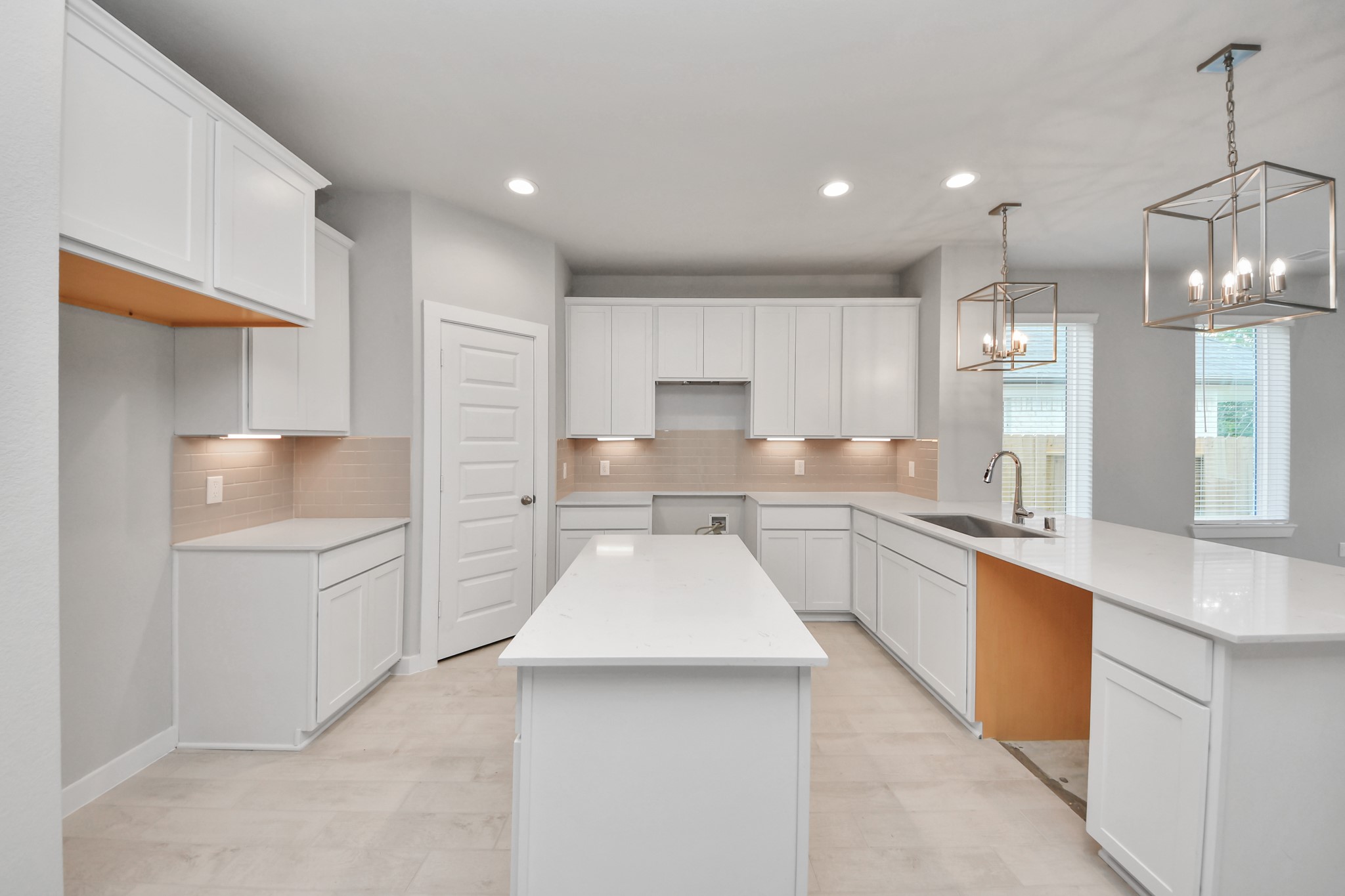 2946 Burris Park Drive Spring, TX 77373 - Photo 11 of 45 a large kitchen with kitchen island a sink stainless steel appliances and cabinets