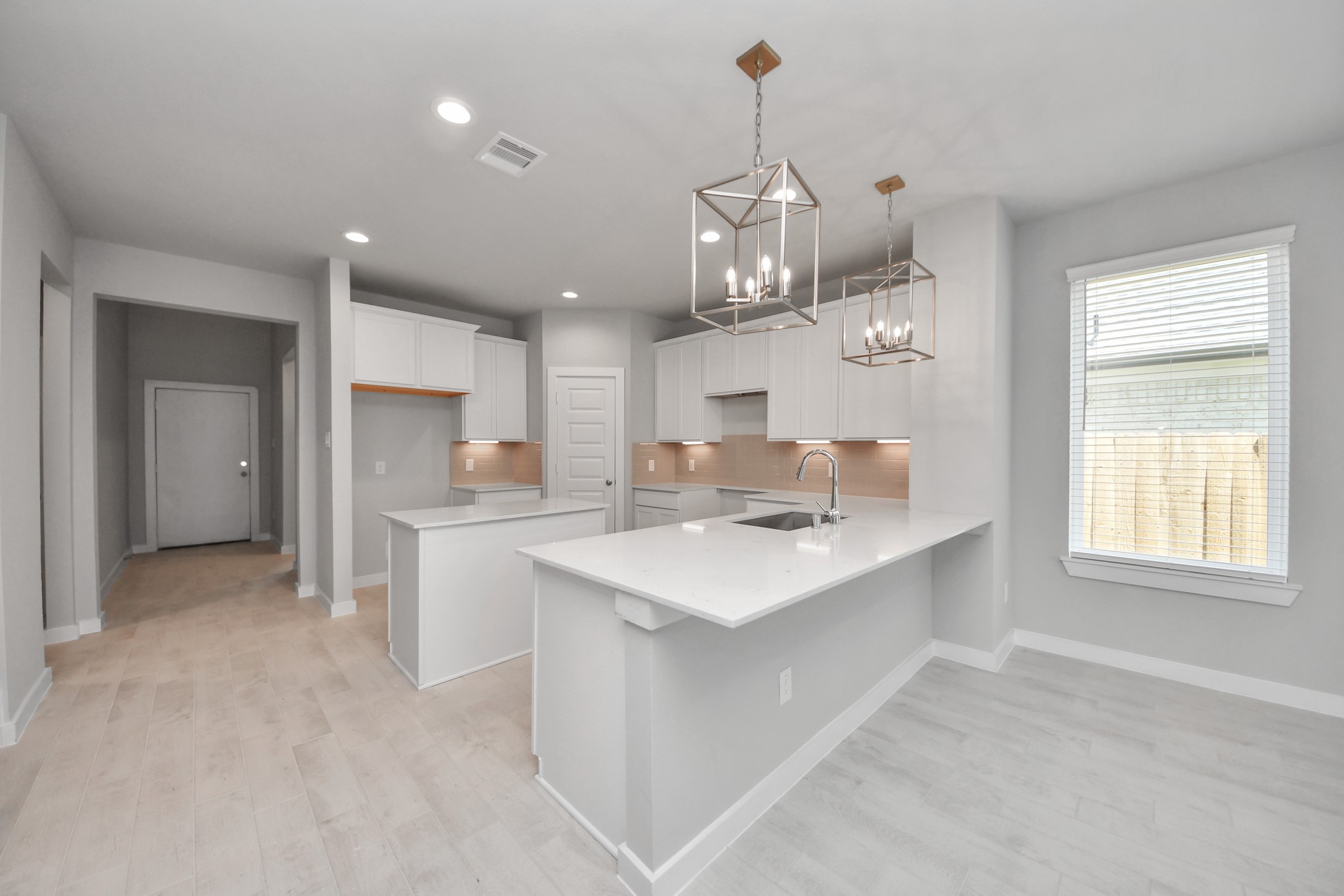 2946 Burris Park Drive Spring, TX 77373 - Photo 12 of 45 a kitchen with kitchen island a sink stainless steel appliances and cabinets