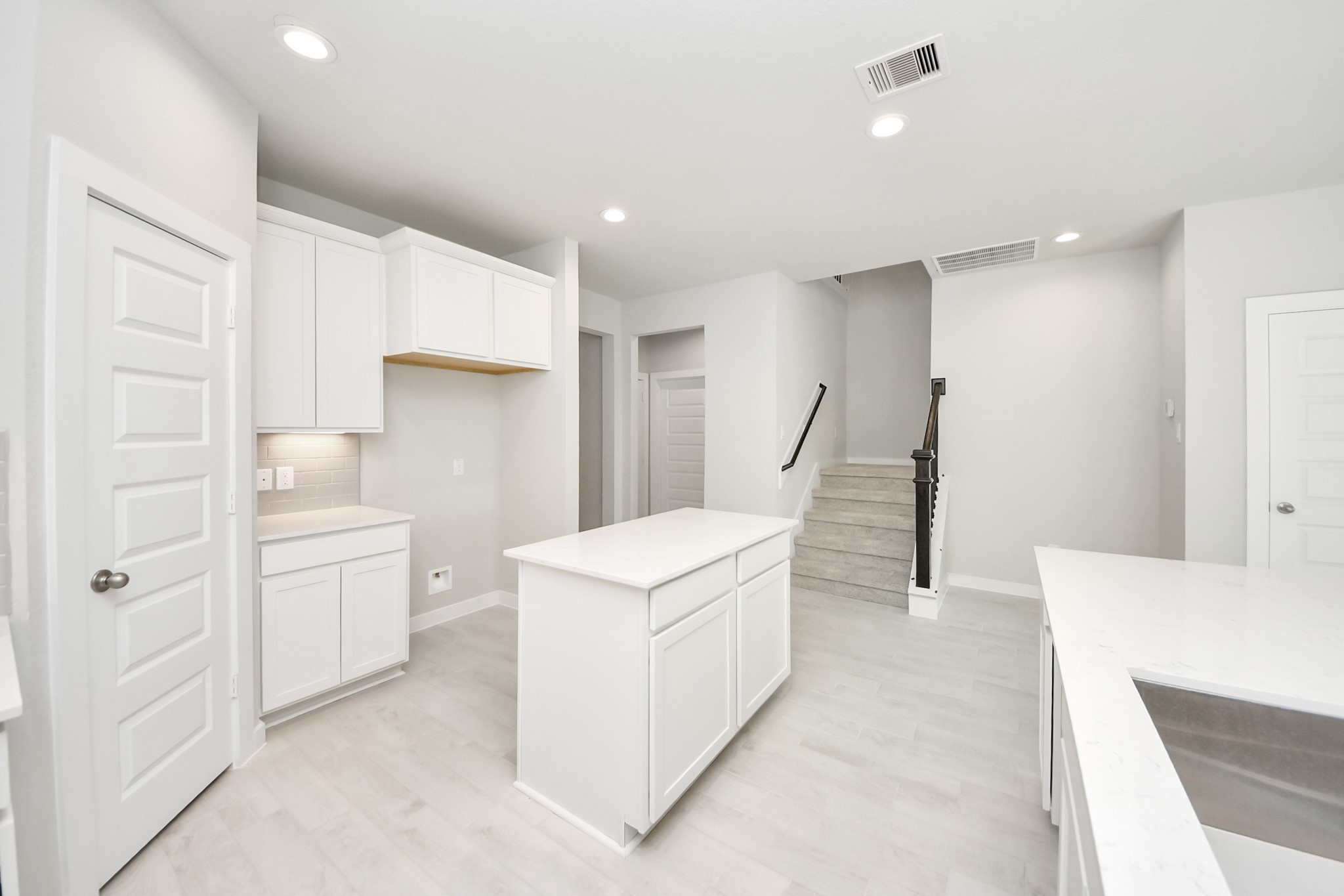 2946 Burris Park Drive Spring, TX 77373 - Photo 12 of 37 a kitchen with white cabinets and white appliances