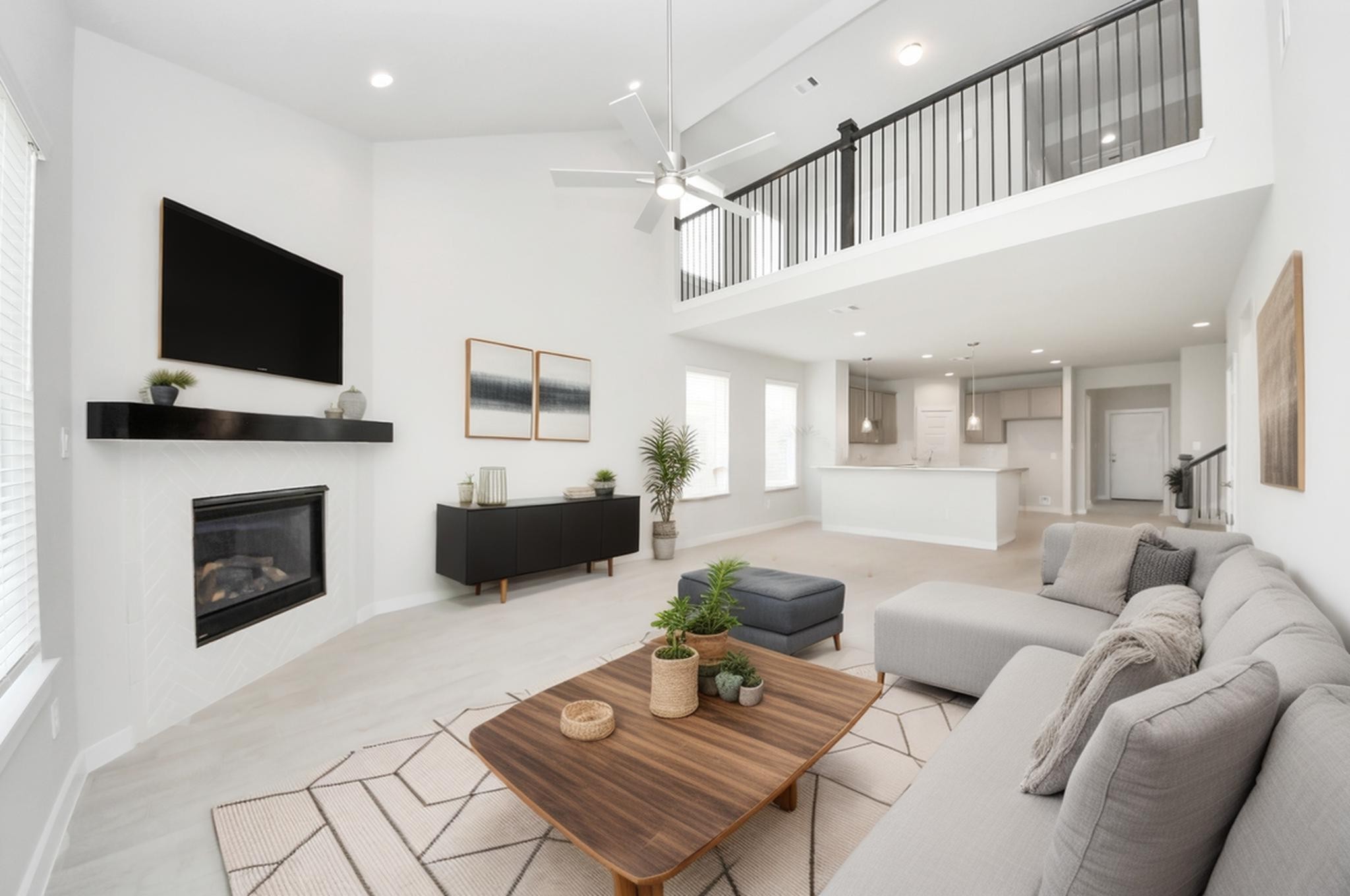 2946 Burris Park Drive Spring, TX 77373 - Photo 15 of 37 a living room with furniture a flat screen tv and a fireplace