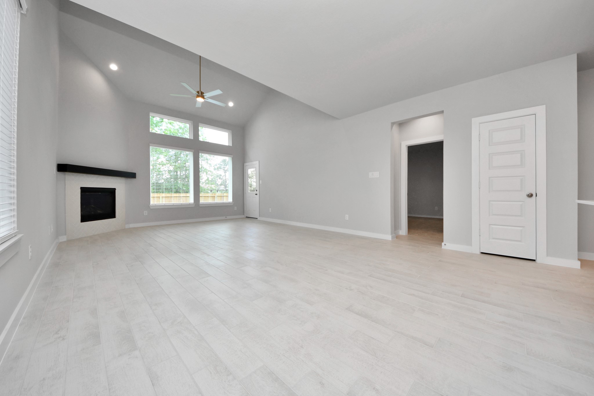 2946 Burris Park Drive Spring, TX 77373 - Photo 20 of 45 an empty room with windows and fireplace