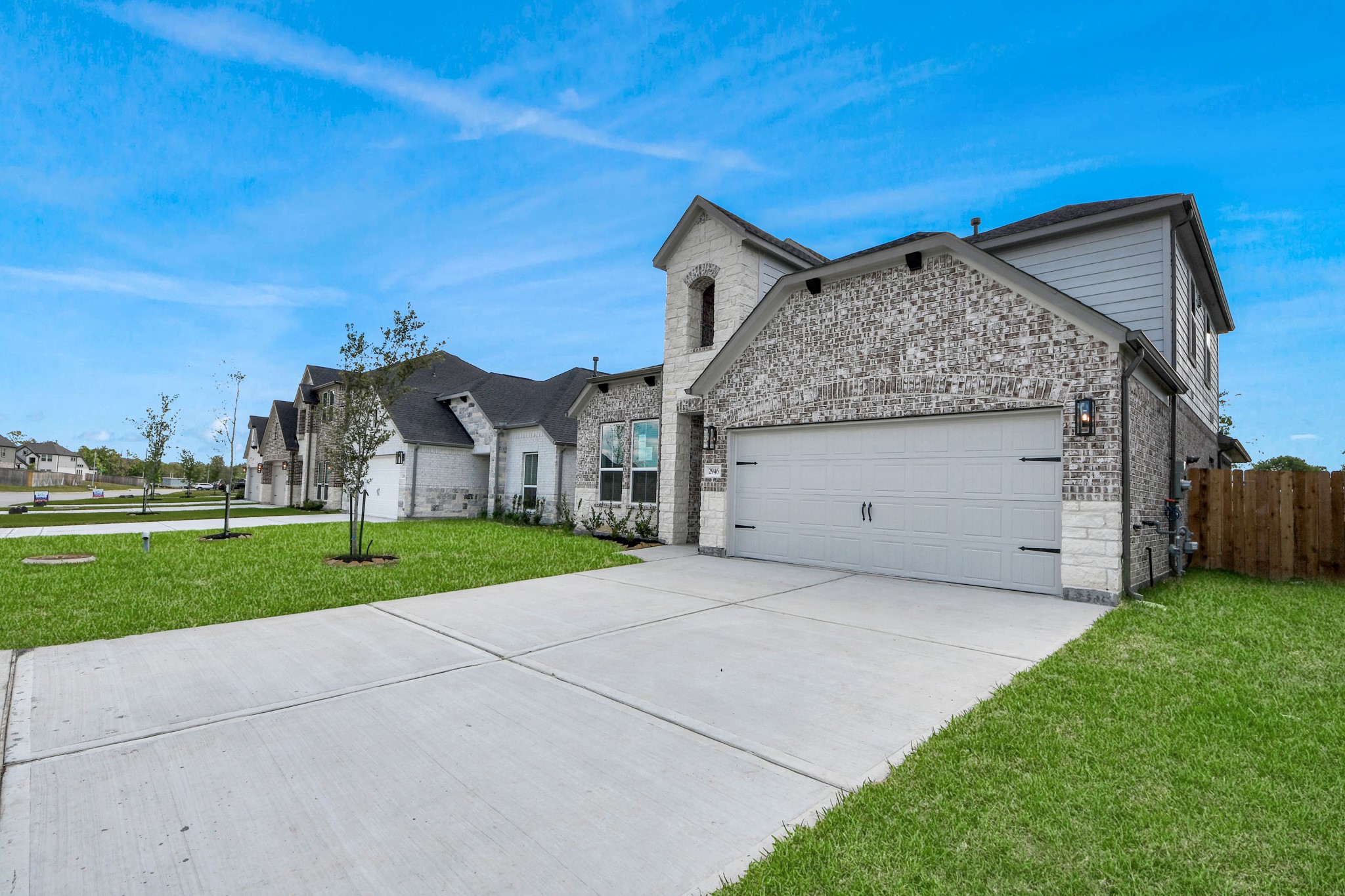 2946 Burris Park Drive Spring, TX 77373 - Photo 2 of 45 Home features a convenient 2-car garage complemented by a spacious driveway, offering ample parking for you and your guests.