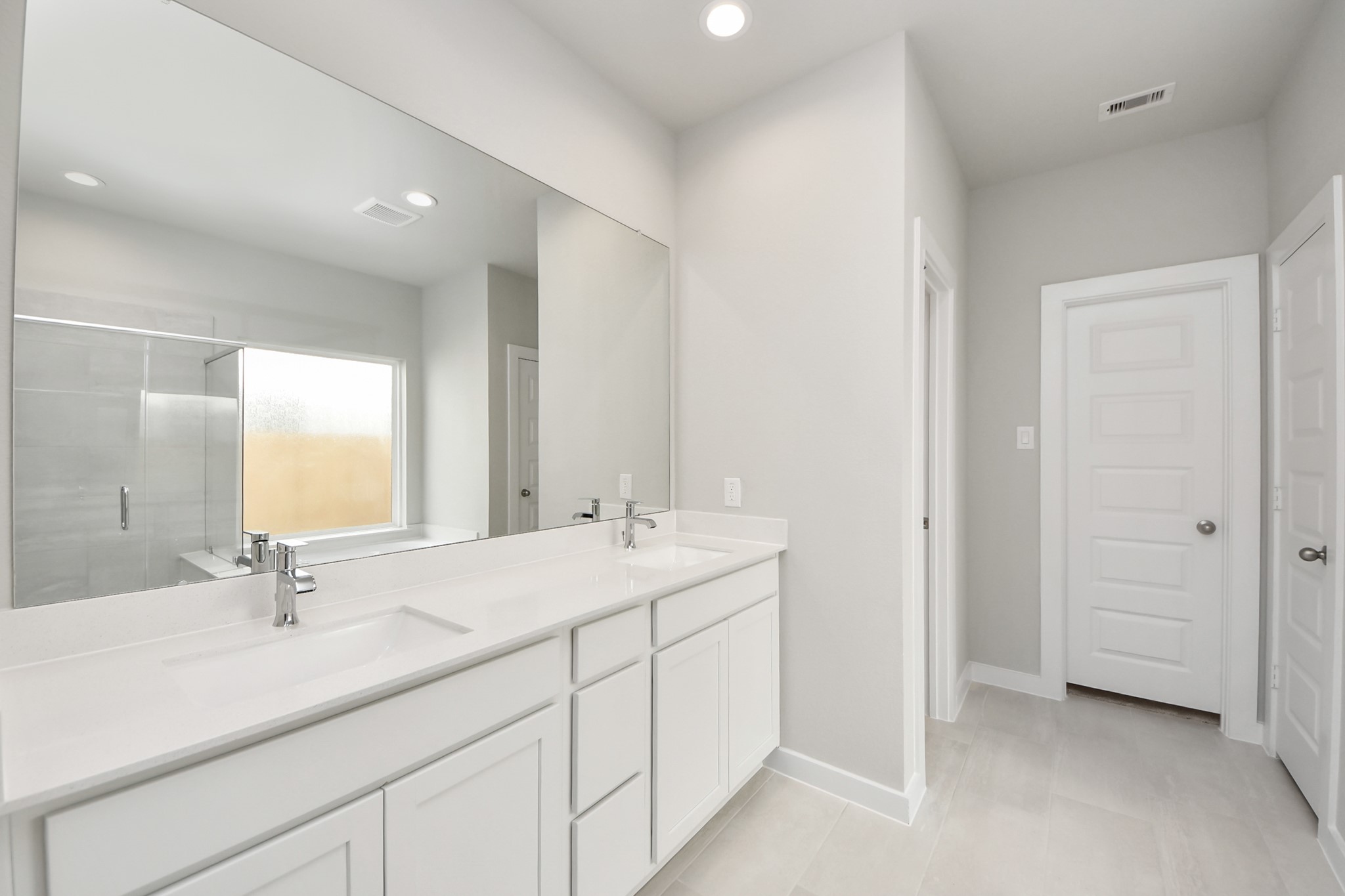 2946 Burris Park Drive Spring, TX 77373 - Photo 22 of 37 a bathroom with double sink and a mirror