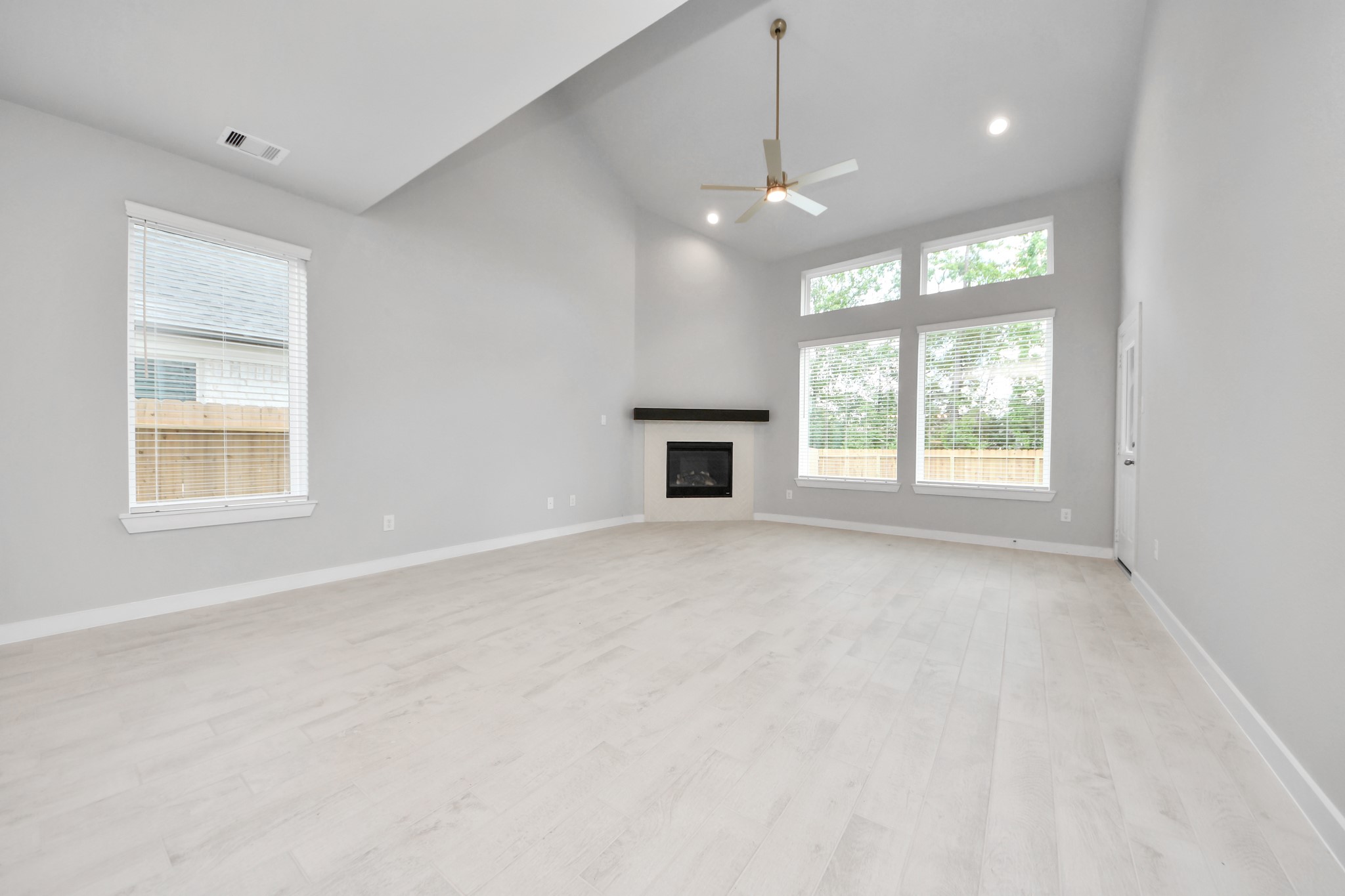 2946 Burris Park Drive Spring, TX 77373 - Photo 23 of 45 an empty room with chandelier fan and windows
